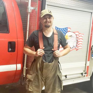 Volunteer Dominick suiting up with the Arcadia Fire Department to run calls during the hurricane