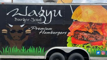 Food truck side advertising Wagyu Burger Joint.