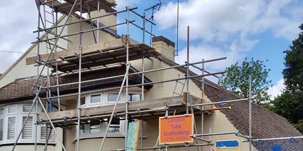 scaffolding on a tall house.