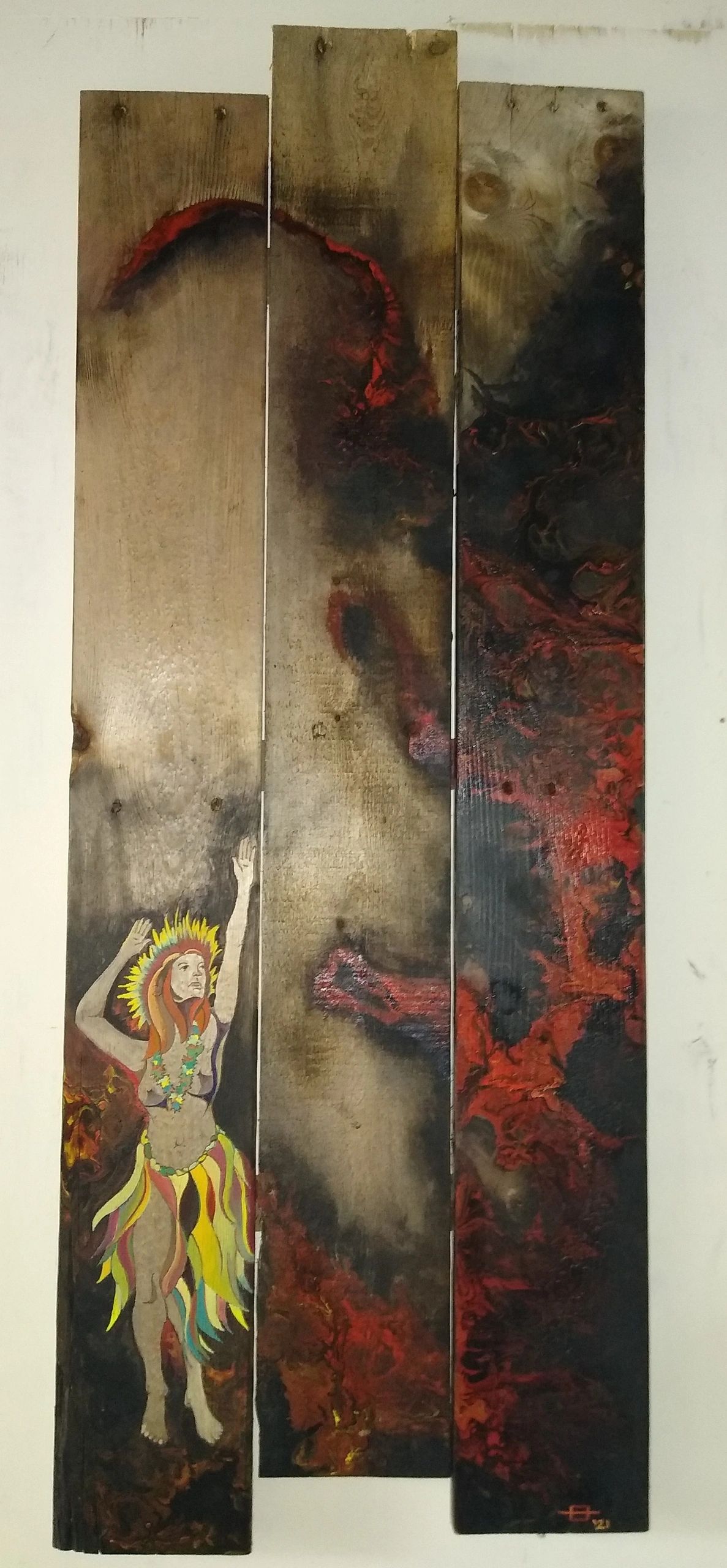 Colorful tropical dancer painted on wooden planks with fiery background.