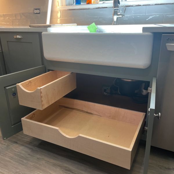 Custom made wood pull out shelves for the cabines under your sink.