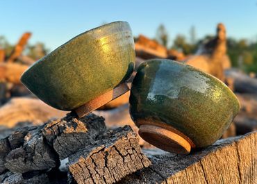 Handthrown bowls with a green oribe glaze
