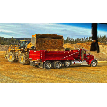 dump truck getting loaded with dirt