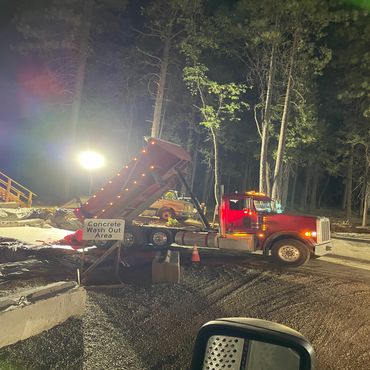 dump truck in the dark dumping material