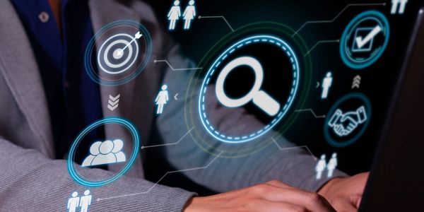 Business person interacting with futuristic digital interface icons.