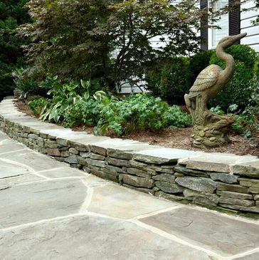stacked stone installed with blue stone walkway