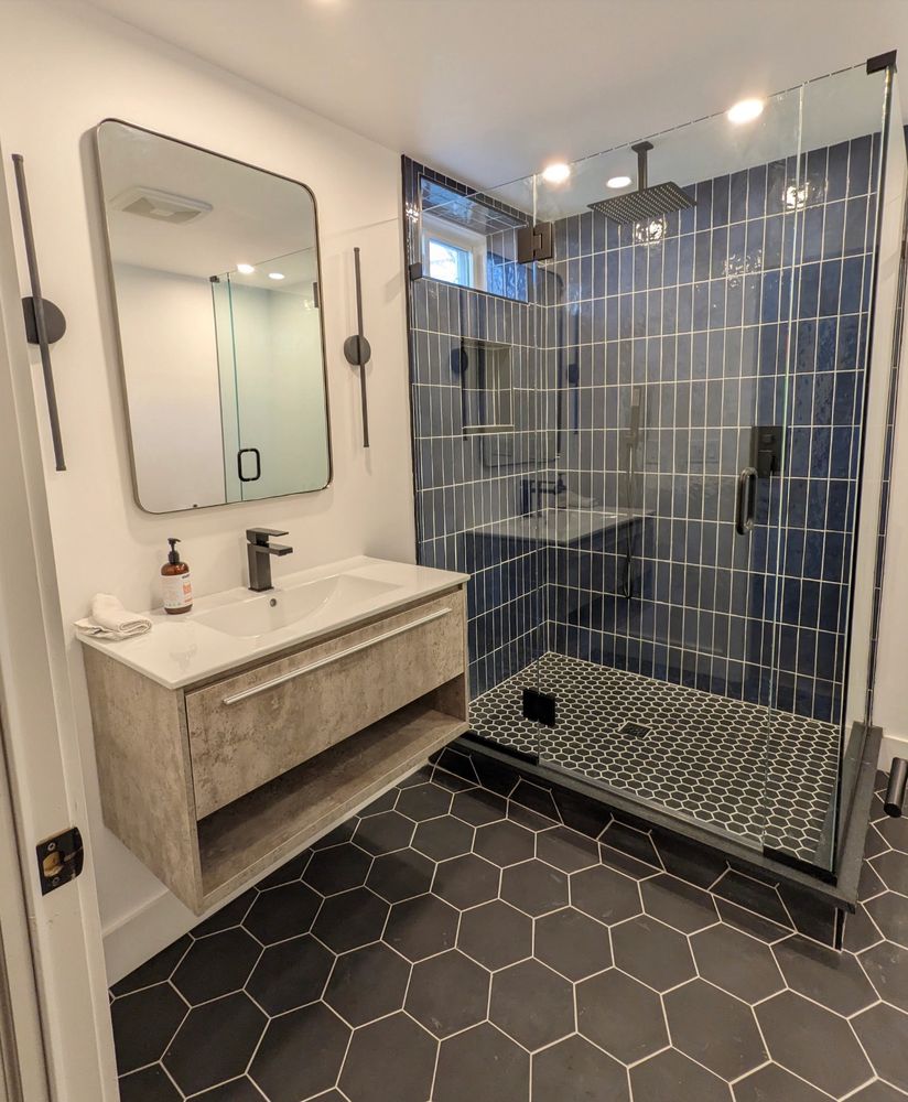 Luxury Executive's Bathroom next to his soundproofed office in 1,000 sf finished basement we built