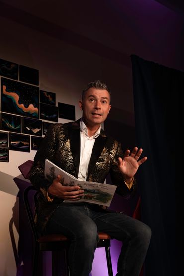 Close-up of main actor delivering lines with dramatic lighting