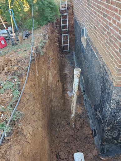 Excavated foundation wall with cracks