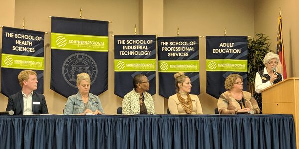 Green Oaks Center Executive Director Russ Joiner (pictured far left) participated in the Partnering