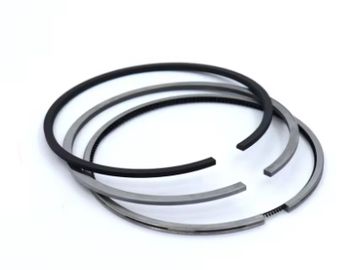 Set of engine piston rings with different designs and colors.