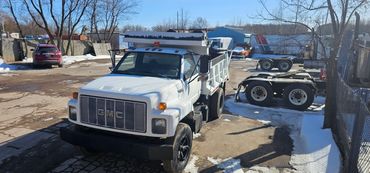 Burton Excavating, Inc - 49783 site prep, water/sewer/septic system, landscape materials. Dump Truck