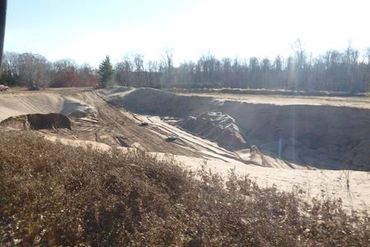 Burton Excavating Inc 49783 site prep, water/sewer/septic system, landscape materials 15 Mile Rd pit