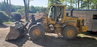 Burton Excavating, Inc. 49783 used equipment for sale site prep septic systems, water lines material