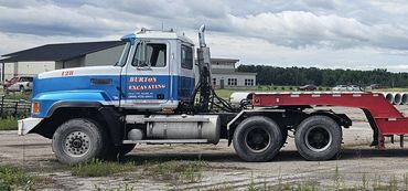 Burton Excavating, Inc - 49783 site prep, water/sewer/septic system, landscape materials. Dump Truck