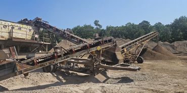 Burton Excavating Inc 49783 sand stone gravel site prep sewer repair land clearing waste removal