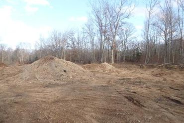 Burton Excavating Inc 49783 site prep, water/sewer/septic system, landscape materials 15 Mile Rd pit