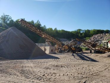 Burton Excavating Inc 49783 sand, stone, gravel site prep sewer repair crushing screening aggregate
