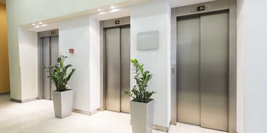 Bank of elevators in an apartment.
