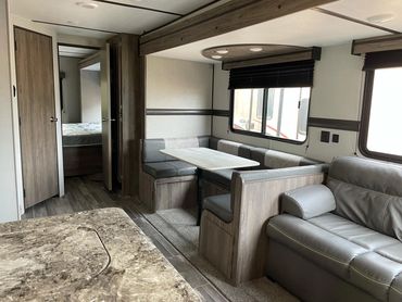 2021 Zinger 32' Dining and Sitting area