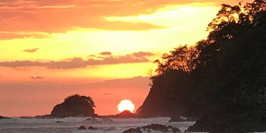 Beautiful sunset, island, jungle and ocean view at 200 hour yoga teacher training Quepos Costa Rica