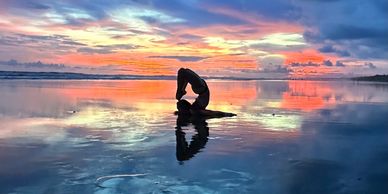 Advanced yoga on the beach at sunset during a 200 hour yoga teacher training Quepos Costa Rica 2025
