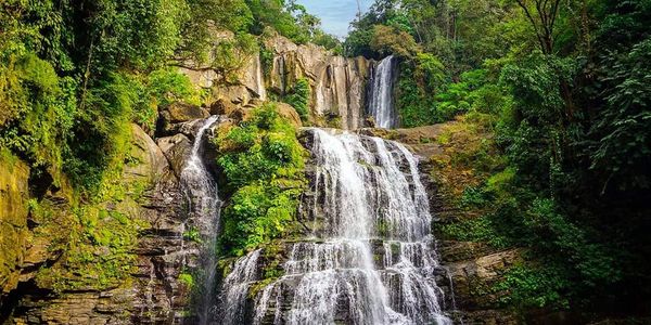 River, sky, and jungle at Nauyaca waterfall during wellness and yoga training retreat in Costa Rica