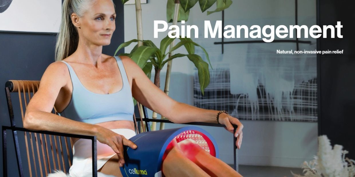 Woman using a device for natural pain management on her legs.