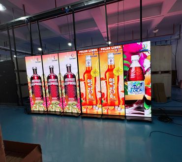 Illuminated advertising panels for Absolut Raspberry, Polar Limes, and Nestea Ice drinks.
