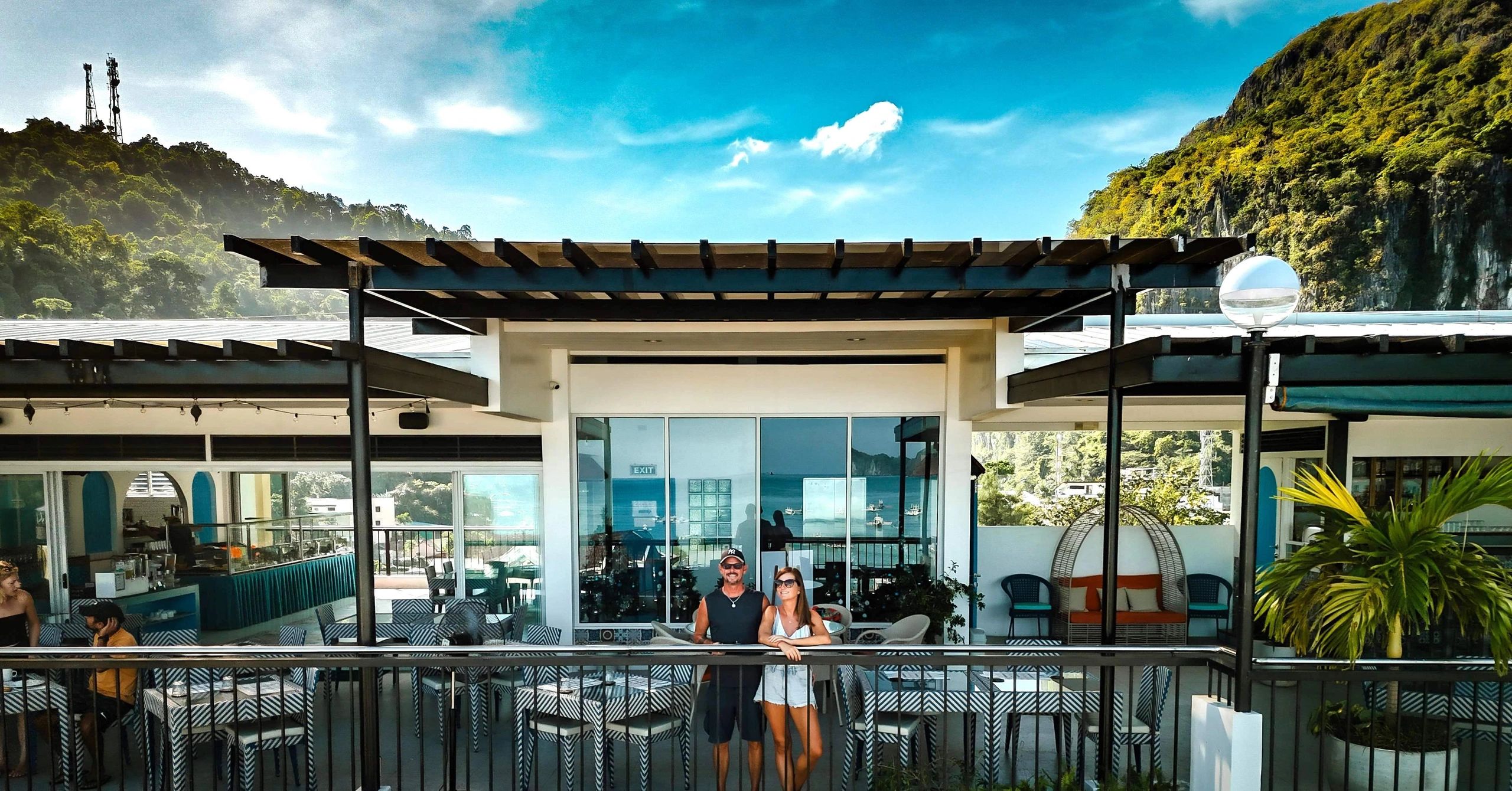 A couple enjoying their stay on the rooftop view deck