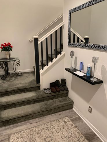 Accent stair railing painting, floating shelf installation and mirror hanging