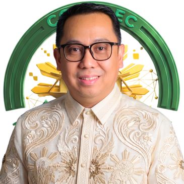 Man in traditional Barong Tagalog with glasses, smiling.