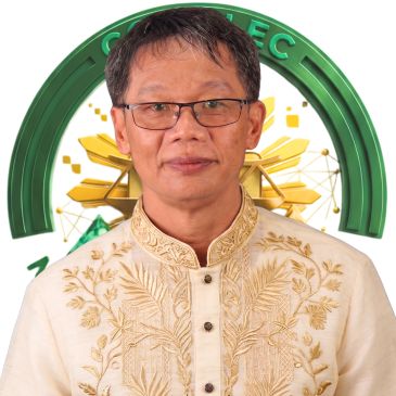 Man in traditional embroidered Filipino attire with glasses.
