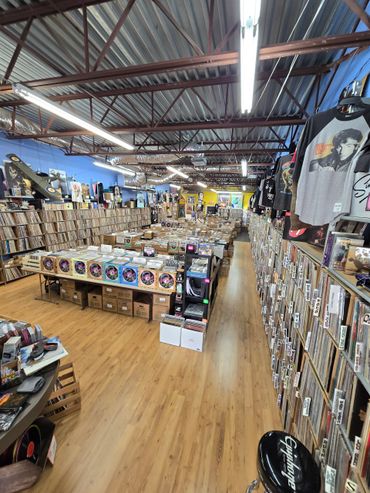 A vibrant record store filled with vinyl records and music memorabilia.