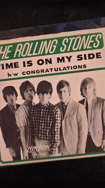 The Rolling Stones' vintage single "Time Is On My Side" cover with band members.