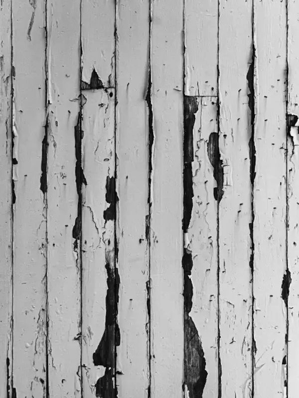 A fence with peeling paint.