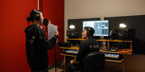 One-on-one music lesson at X-Talent in a professional studio environment.