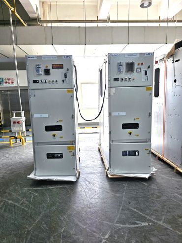 Two large industrial electrical control panels in a well-lit facility.
