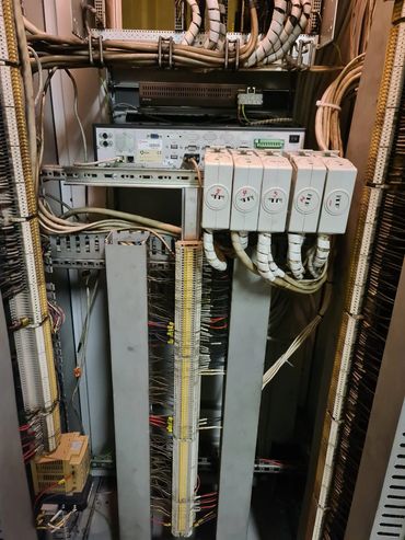 Electrical control panel with labeled wiring and connections.