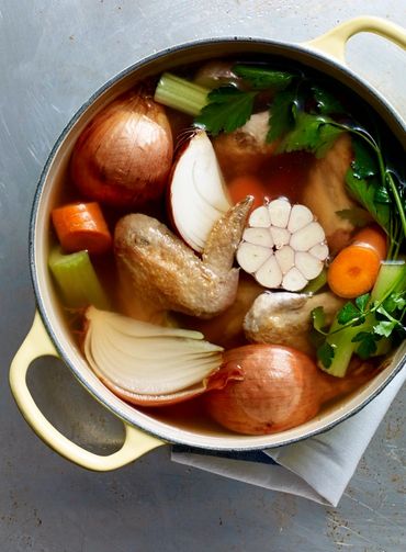 Chicken soup with veggies in a pot