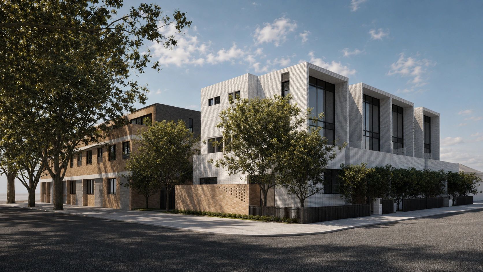 Modern residential buildings with large windows and trees along the street.