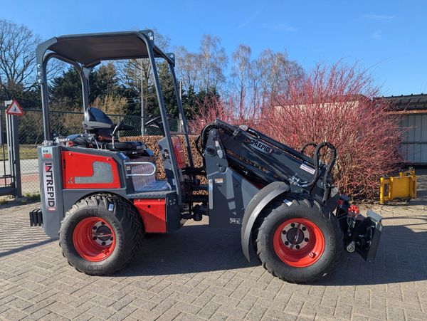 Compact Intrepid construction vehicle with red and black design.