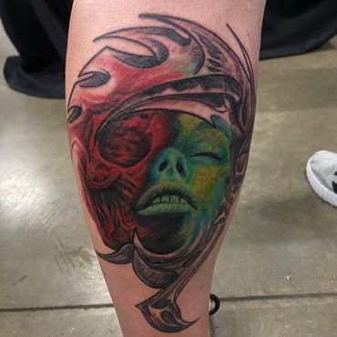 Vibrant color surreal woman portrait tattoo in red, green and blue