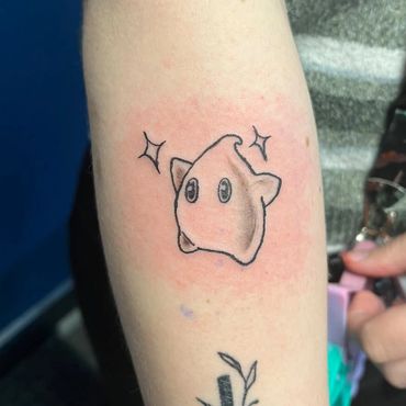 Small cute star character tattoo by apprentice Eva