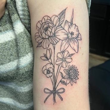 Floral bouquet linework tattoo by apprentice Eva