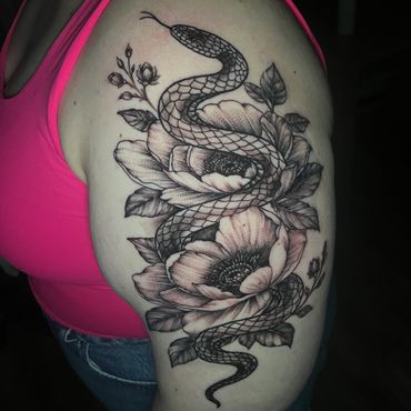Black and grey snake and peony flower tattoo on thigh