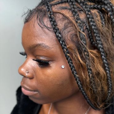 Nose hoop and check dermal piercings