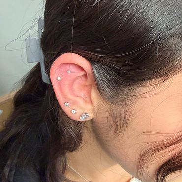 Stacked multiple cartilage and ear lobe piercings