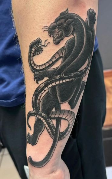 Black panther and snake traditional tattoo