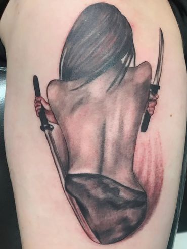 Dark horror character holding knives tattoo